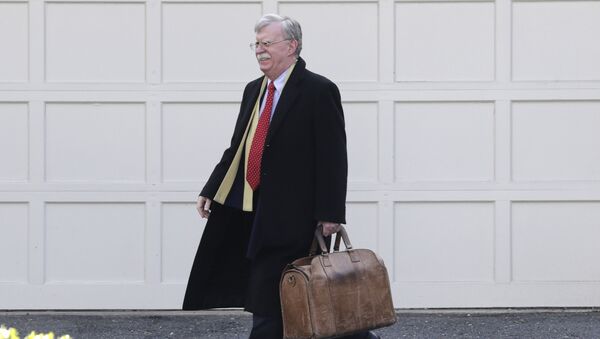 Former National security adviser John Bolton leaves his home in Bethesda, Md. Tuesday, Jan. 28, 2020. President Donald Trump's legal team is raising a broad-based attack on the impeachment case against him even as it mostly brushes past allegations in a new book that could undercut a key defense argument at the Senate trial. - Sputnik International