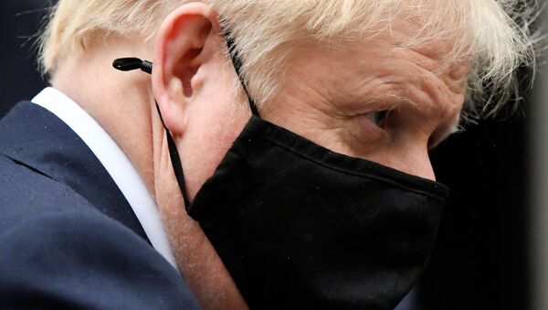 Britain's Prime Minister Boris Johnson, wearing a protective mask, leaves 10 Downing Street in London, Britain October 21, 2020 - Sputnik International