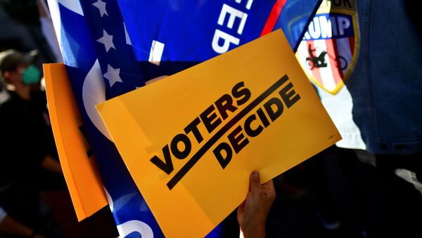 A Voters Decide sign is pictured as people demonstrate outside of the Philadelphia Convention Center, where votes are still being counted two days after the 2020 U.S. presidential election, in Philadelphia, Pennsylvania, US November 5, 2020 - Sputnik International