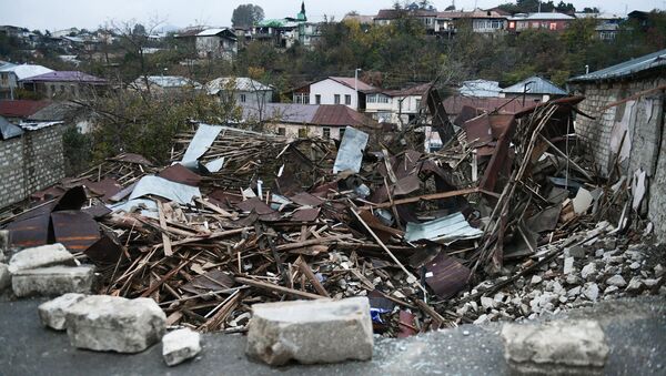 A view shows a damaged building in Stepanakert, the self-proclaimed Nagorno-Karabakh Republic - Sputnik International