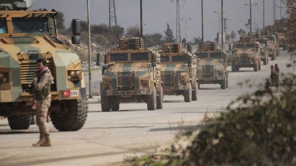 Turkish military convoy drives in Idlib province, Syria, Saturday, Feb. 22, 2020 - Sputnik International
