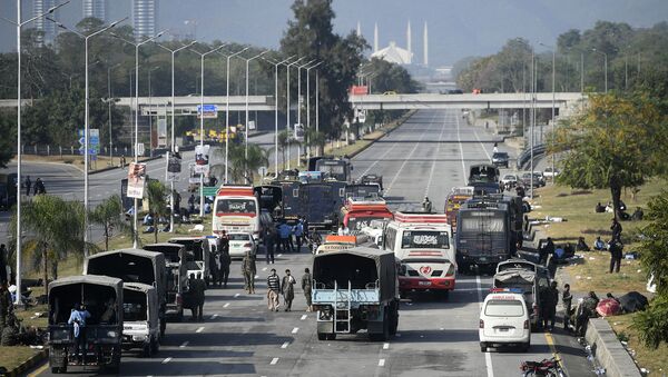 Security forces vehicles are seen along the blocked Islamabad-Rawalpindi highway during an anti-France demonstration by activists and supporters of the Tehreek-e-Labbaik Pakistan (TLP), a religious party, in Islamabad on November 16, 2020. - Pakistan authorities sealed off a major road into the capital Islamabad for a second day on November 16 as a far-right religious party held fresh anti-France protests. - Sputnik International