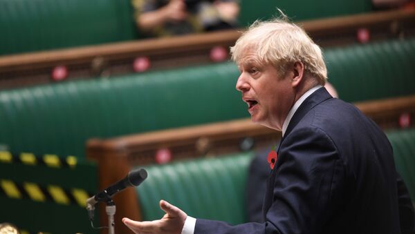 A handout photograph released by the UK Parliament shows Britain's Prime Minister Boris Johnson speaking during the weekly Prime Minister's Questions (PMQs) in the House of Commons in London on November 11, 2020. - Sputnik International