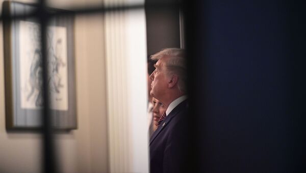 U.S. President Donald Trump stands in the press office with other staff after giving a briefing at the White House in Washington, U.S., November 5, 2020. - Sputnik International