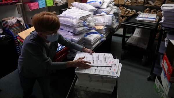 The election official Pam Hainault works in the ballot room organizing unused ballots returned from voting precincts after Election Day at the Kenosha Municipal Building in Kenosha, Wisconsin, U.S. November 4, 2020 - Sputnik International