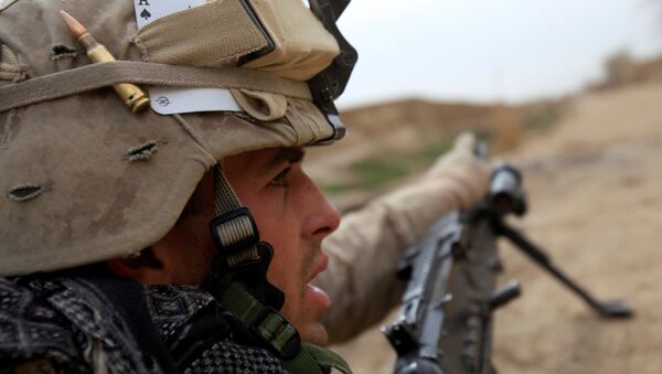 A U.S. Marine from Bravo Company of the 1st Battalion, 6th Marines gestures during an operation in Marjah, Helmand province February 21, 2010. NATO forces are facing strong resistance eight days into a major offensive in southern Afghanistan as Taliban fighters dig in to fight to the death. - Sputnik International