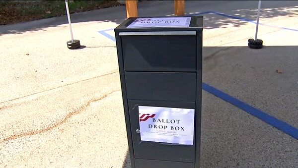 This photo from video provided by ABC7 Los Angeles shows an unofficial ballot drop box at Grace Baptist Church in Santa Clarita, Calif., in October, 2020. California's ballot harvesting law is creating controversy this election year. The law allows for people to collect ballots from voters and return them to county election offices. Republicans have set up unofficial drop boxes in some counties with closely contested U.S. House races. State officials say the boxes are illegal and have ordered the party to remove them. But party leaders say they are using the boxes to collect ballots as the law allows. At least one Democratic campaign has designated volunteers who receive ballots at their homes from voters who want help in returning them. - Sputnik International