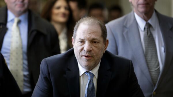 In this Feb. 24, 2020, file photo, Harvey Weinstein arrives at a Manhattan courthouse as jury deliberations continue in his rape trial in New York. The disgraced Hollywood film mogul and convicted rapist is asking a bankruptcy judge in Delaware to allow him to pursue arbitration in New York over what he claims is his wrongful termination from the company he co-founded. - Sputnik International