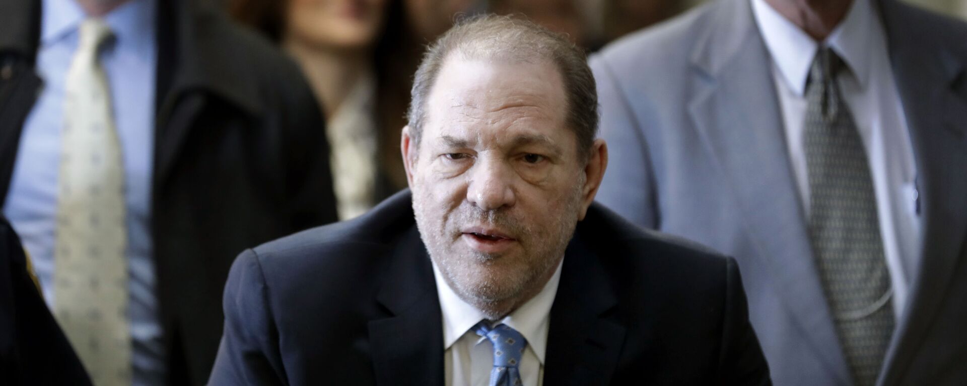 In this Feb. 24, 2020, file photo, Harvey Weinstein arrives at a Manhattan courthouse as jury deliberations continue in his rape trial in New York. The disgraced Hollywood film mogul and convicted rapist is asking a bankruptcy judge in Delaware to allow him to pursue arbitration in New York over what he claims is his wrongful termination from the company he co-founded. - Sputnik International, 1920, 18.11.2020