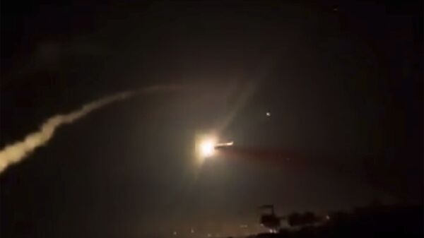This frame grab from a video provided by the Syrian official news agency SANA shows missiles flying into the sky near Damascus, Syria, Tuesday, Dec. 25, 2018. Israeli warplanes flying over Lebanon fired missiles toward areas near the Syrian capital of Damascus late Tuesday, hitting an arms depot and wounding three soldiers, Syrian state media reported, saying that most of the missiles were shot down by air defense units. - Sputnik International