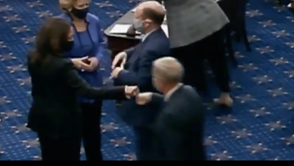 Screenshot from the video showing Senator Kamala Harris fistbumping her Republican colleague, Senator Lindsey Graham in the Senate - Sputnik International