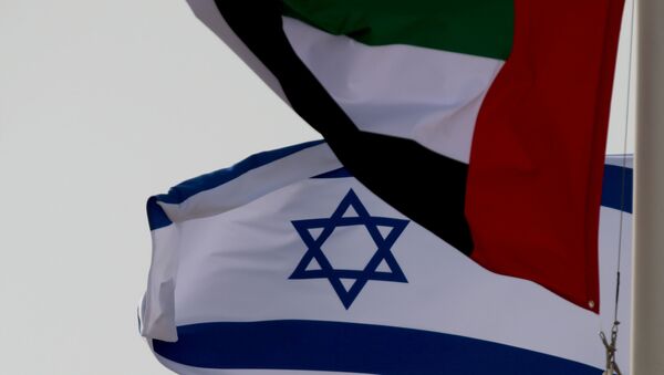 FILE PHOTO: Emirati and Israeli flags fly upon the arrival of Israeli and U.S. delegates at Abu Dhabi International Airport, in Abu Dhabi, United Arab Emirates August 31, 2020 - Sputnik International