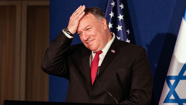 US Secretary of State Mike Pompeo pats his head during a press conference with the Israeli Prime Minister and Bahrain's Foreign Minister after their trilateral meeting in Jerusalem on November 18, 2020.  - Sputnik International