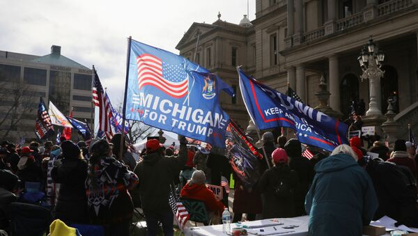 Supporters of U.S. President Donald Trump participate in a Stop the Steal protest after the 2020 U.S. presidential election was called for Democratic candidate Joe Biden, in Lansing, Michigan, U.S. 14 November 2020. - Sputnik International
