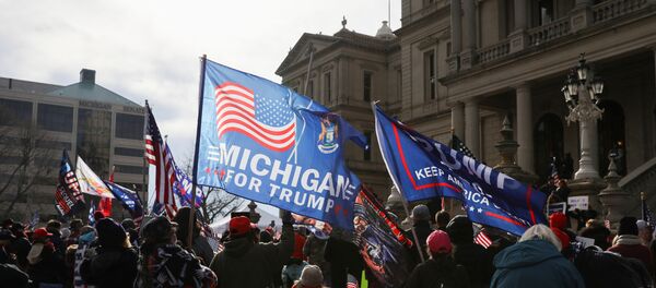 Supporters of U.S. President Donald Trump participate in a Stop the Steal protest after the 2020 U.S. presidential election was called for Democratic candidate Joe Biden, in Lansing, Michigan, U.S. 14 November 2020. Supporters of U.S. President Donald Trump participate in a Stop the Steal protest after the 2020 U.S. presidential election was called for Democratic candidate Joe Biden, in Lansing, Michigan, U.S. 14 November 2020. - Sputnik International