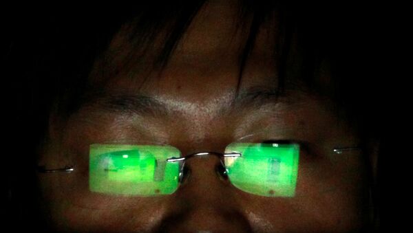 A hacker, who asked not to have his name revealed, works on his laptop in his office in Taipei July 10, 2013.  - Sputnik International
