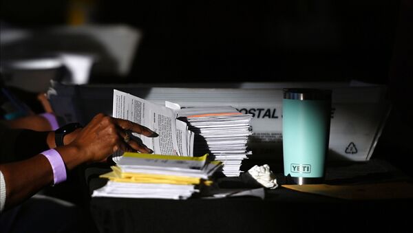 An employee of the Fulton County Board of Registration and Elections processes ballots in Atlanta, Georgia, 5 November 2020.  - Sputnik International
