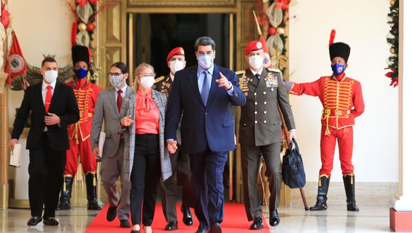 Venezuela's President Nicolas Maduro walks before holding a virtual news conference in Caracas, Venezuela October 28, 2020. - Sputnik International