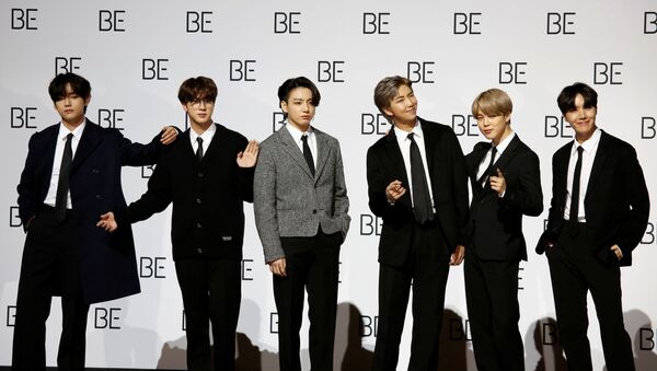 Members of K-pop boy band BTS pose for photographs during a news conference promoting their new album BE(Deluxe Edition) in Seoul, South Korea, November 20, 2020 - Sputnik International