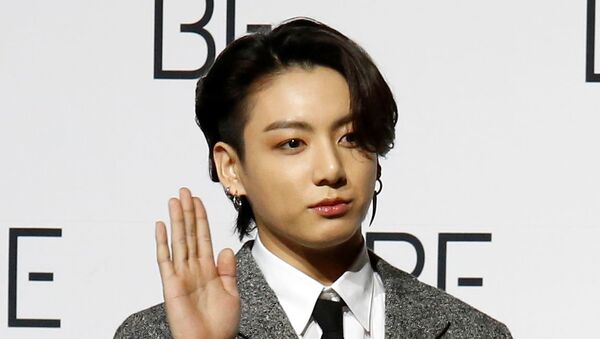 K-pop boy band BTS member Jung Kook poses for photograph during a news conference promoting their new album BE(Deluxe Edition) in Seoul, South Korea, 20 November 2020 - Sputnik International
