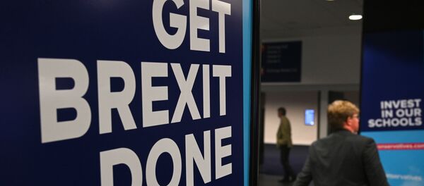Conservative Party branding encouraging them to Get Brexit Done and Invest in our Schools is seen at the Manchester Central convention complex in Manchester, north-west England on September 29, 2019, on the first day of the annual Conservative Party conference. - Embattled British Prime Minister Boris Johnson gathered his Conservative party Sunday for what could be its final conference before an election, promising to get Brexit done. - Sputnik International