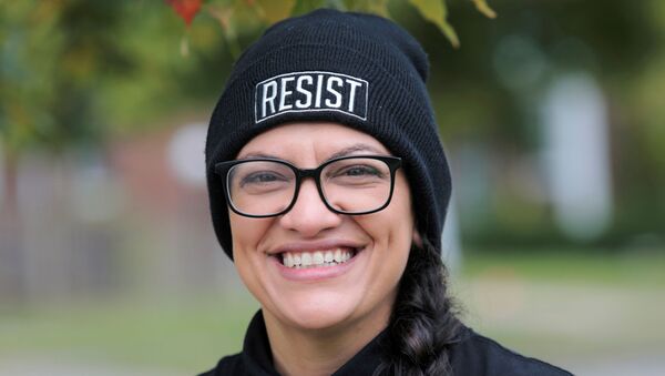 Democratic Rep. Rashida Tlaib poses for a photograph before knocking on doors to encourage residents to vote in the upcoming presidential elections in Detroit, Michigan, U.S., October 18, 2020.  - Sputnik International