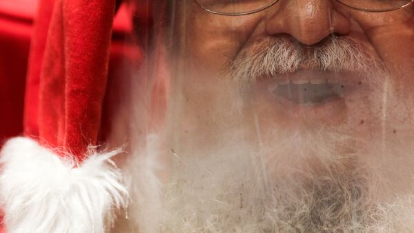 A man who goes by Santa Claus Edi Noel is pictured as he prepares to interact with children by video at NorteShopping mall amid the coronavirus disease (COVID-19) outbreak, in Rio de Janeiro, Brazil, 13 November 2020 - Sputnik International