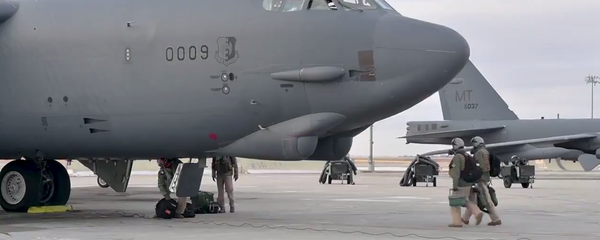 A screenshot of a video showing B-52 bomber being prepared for the flight at the military base in North Dakota, US  - Sputnik International