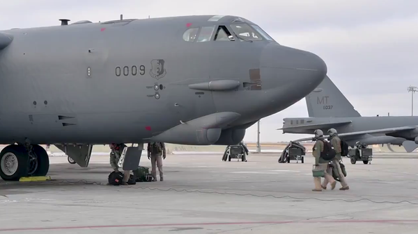 A screenshot of a video showing B-52 bomber being prepared for the flight at the military base in North Dakota, US  - Sputnik International