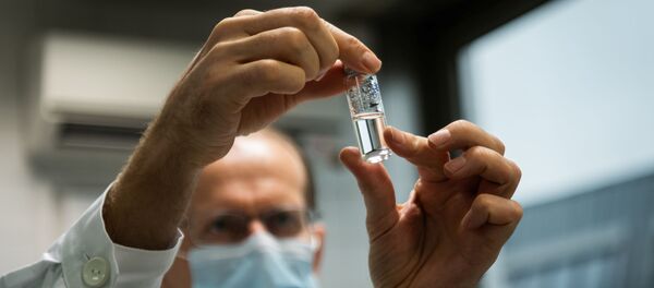A laboratory assistant holds a tube with Russia's Sputnik-V vaccine against the coronavirus disease (COVID-19) at the National Institute of Pharmacy and Nutrition in Budapest, Hungary, November 19, 2020. - Sputnik International