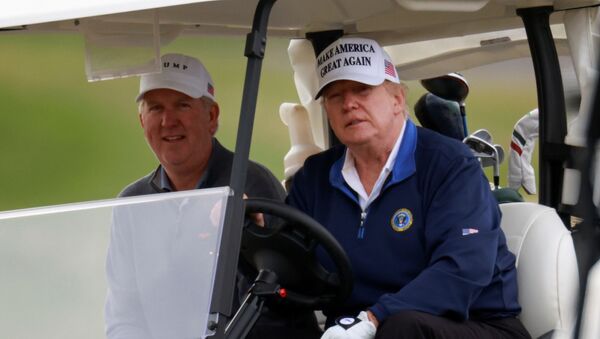 U.S. President Donald Trump drives a golf cart at the Trump National Golf Club in Sterling, Virginia, U.S., November 22, 2020 - Sputnik International