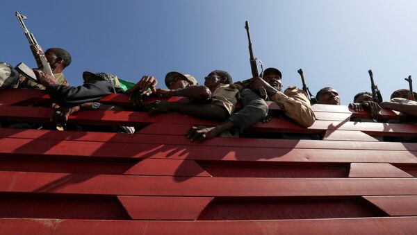 Members of Amhara region militias ride on their truck as they head to the mission to face the Tigray People's Liberation Front (TPLF), in Sanja, Amhara region near a border with Tigray, Ethiopia November 9, 2020 - Sputnik International