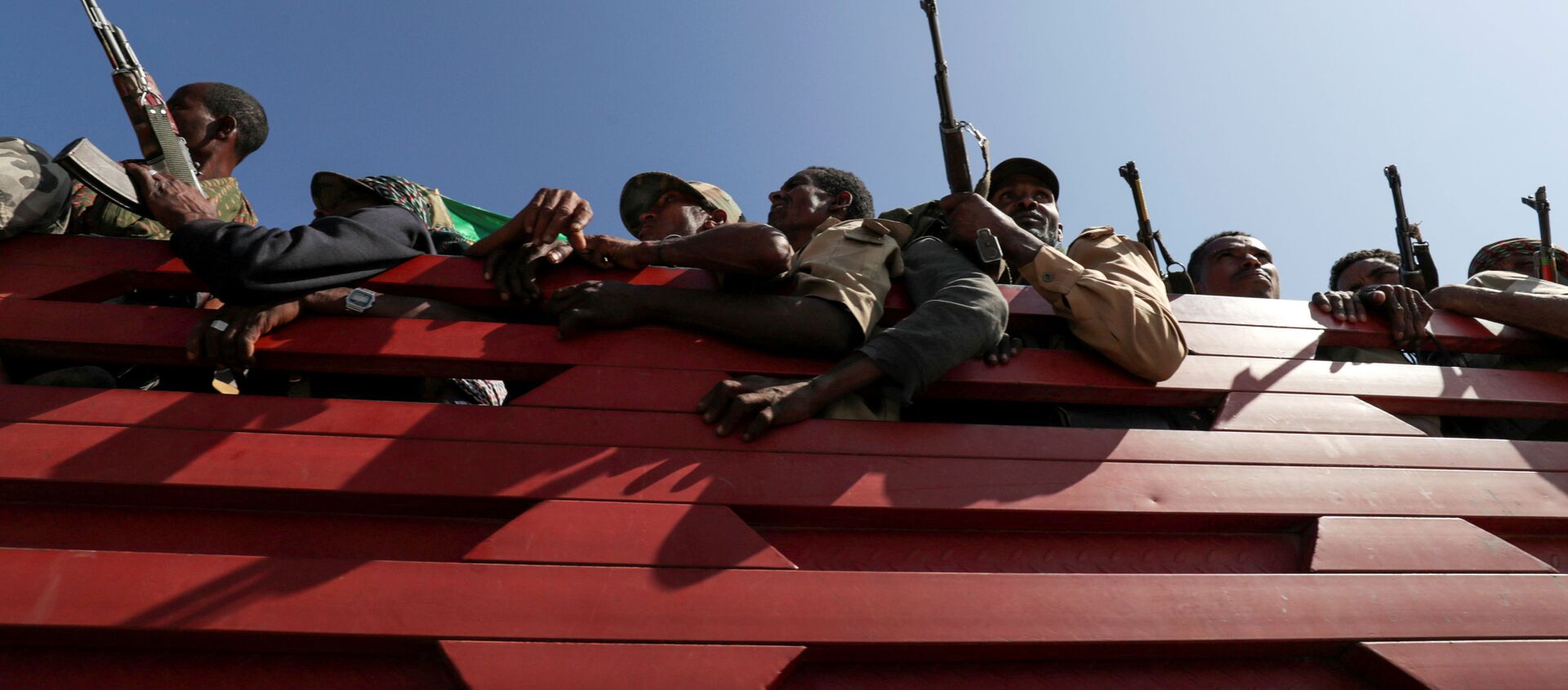 Members of Amhara region militias ride on their truck as they head to the mission to face the Tigray People's Liberation Front (TPLF), in Sanja, Amhara region near a border with Tigray, Ethiopia November 9, 2020 - Sputnik International, 1920, 18.12.2020
