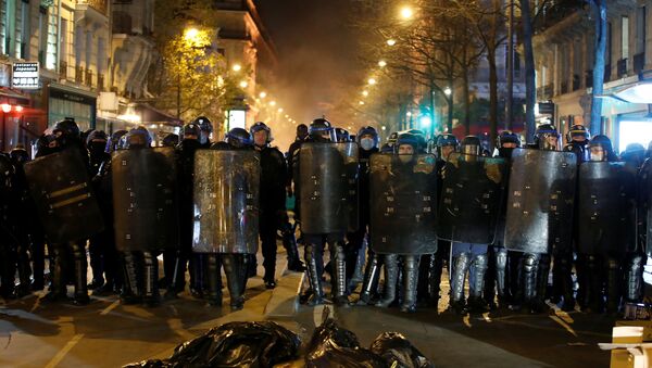 French CRS riot police form a line during a protest to show support for asylum seekers, and to denounce police violence and an unwelcoming policy towards migrants in France, after clashes sparked when French police cleared out a new migrant camp at Place de la Republique in Paris, France, November 24, 2020. - Sputnik International
