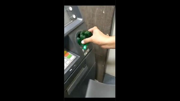 Using ATM to withdraw cash....?   - Sputnik International