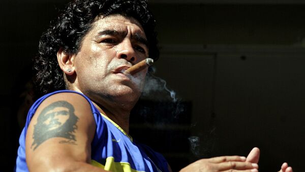 FILE PHOTO: Former Argentine soccer star Diego Maradona smokes a cigar before the start of the Argentine First Division soccer match between Boca Juniors and San Lorenzo de Almagro at La Bombonera stadium in Buenos Aires February 19, 2006 - Sputnik International