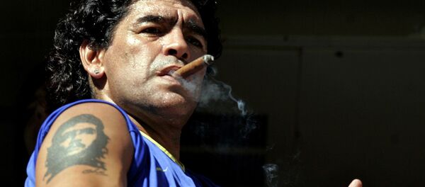 FILE PHOTO: Former Argentine soccer star Diego Maradona smokes a cigar before the start of the Argentine First Division soccer match between Boca Juniors and San Lorenzo de Almagro at La Bombonera stadium in Buenos Aires February 19, 2006 FILE PHOTO: Former Argentine soccer star Diego Maradona smokes a cigar before the start of the Argentine First Division soccer match between Boca Juniors and San Lorenzo de Almagro at La Bombonera stadium in Buenos Aires February 19, 2006 - Sputnik International