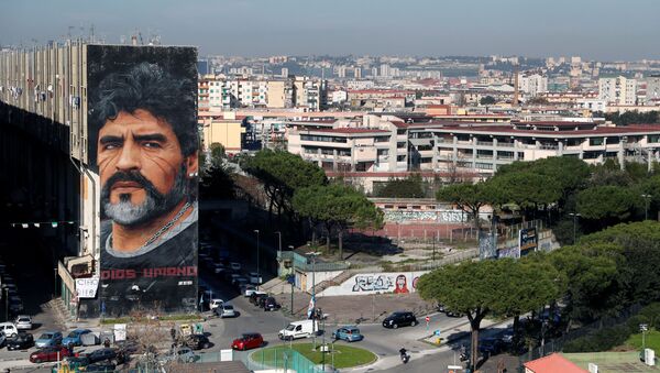 A general view shows a mural by artist Jorit depicting late Argentine soccer legend Diego Maradona, in Naples, Italy November 26, 2020 - Sputnik International
