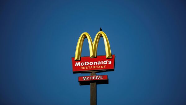 The McDonald's company logo stands on a sign outside a restaurant in Bretigny-sur-Orge, near Paris, France, July 30, 2020. - Sputnik International