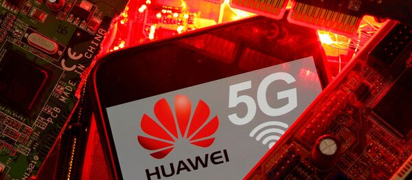 A smartphone with the Huawei and 5G network logo is seen on a PC motherboard in this illustration picture taken January 29, 2020 - Sputnik International