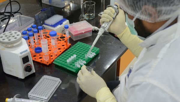 FILE PHOTO: A research scientist works inside a laboratory of India's Serum Institute, the world's largest maker of vaccines, which is working on vaccines against the coronavirus disease (COVID-19) in Pune, India, May 18, 2020. Picture taken May 18, 2020 - Sputnik International