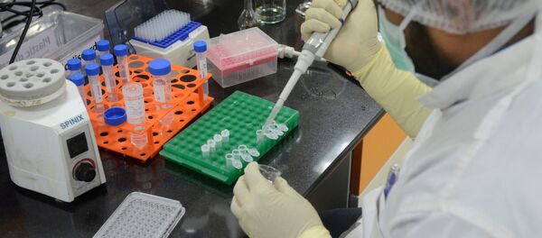 FILE PHOTO: A research scientist works inside a laboratory of India's Serum Institute, the world's largest maker of vaccines, which is working on vaccines against the coronavirus disease (COVID-19) in Pune, India, May 18, 2020. Picture taken May 18, 2020 - Sputnik International