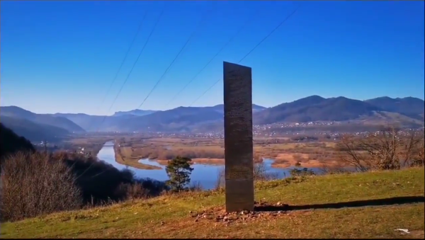 A screenshot from video posted on Twitter depicting the mysterious monolith like object on top of the hill in Romania, 27 November 2020. - Sputnik International