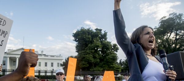 Center for American Progress President Neera Tanden speaks at a protest outside the White House, Tuesday, July 17, 2018, in Washington - Sputnik International
