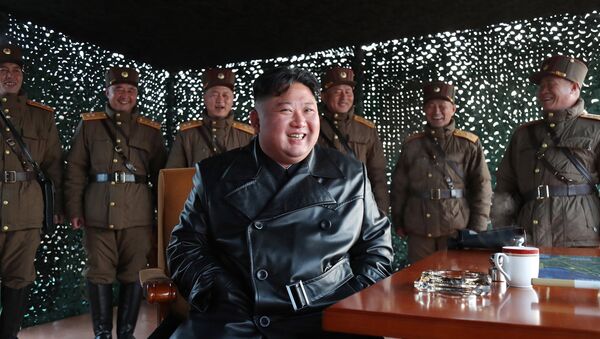 This picture taken on March 21, 2020 and released from North Korea's official Korean Central News Agency (KCNA) on  March 22, 2020 shows North Korean leader Kim Jong Un observing the demonstration fire of tactical guided weapons at an undisclosed location in North Korea - Sputnik International