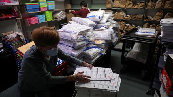 The election official Pam Hainault works in the ballot room organizing unused ballots returned from voting precincts after Election Day at the Kenosha Municipal Building in Kenosha, Wisconsin, U.S. November 4, 2020. REUTERS/Daniel Acker/File Photo - Sputnik International
