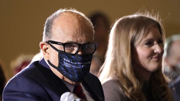 Former Mayor of New York Rudy Giuliani, a lawyer for President Donald Trump, wears a face mask to protect against COVID-19 after speaking at a hearing of the Pennsylvania State Senate Majority Policy Committee, Wednesday, Nov. 25, 2020, in Gettysburg, Pa. - Sputnik International