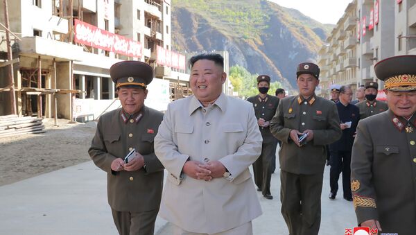 This undated picture released from North Korea's official Korean Central News Agency (KCNA) on October 14, 2020 shows North Korean leader Kim Jong Un (C) inspecting the rehabilitation site in the Komdok area of South Hamgyong Province - Sputnik International