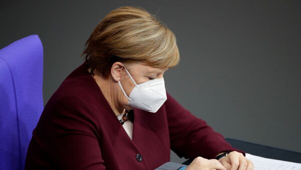 German Chancellor Angela Merkel wears a protective face mask after delivering a speech on the government's response to the coronavirus disease (COVID-19) pandemic in the country's parliament, the Bundestag, in Berlin, Germany, November 26, 2020. - Sputnik International