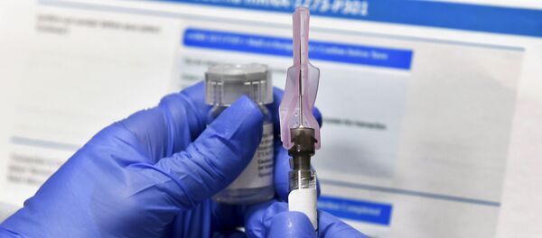 In this Aug. 14, 2020, file photo, laboratory technicians work at the mAbxience biopharmaceutical company on an experimental coronavirus vaccine developed by Oxford University and the laboratory AstraZeneca in Garin, Argentina. - Sputnik International